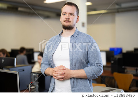 Guy in computer design and information technology classroom Guy in computer design and information technology classroom 138698480