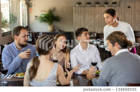 Waitress takes order from group of friends 138698505