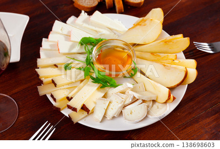 Cheese plate with pears and honey 138698603