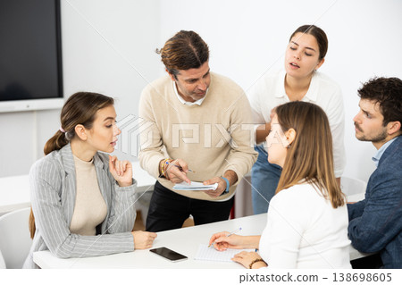 College students in study group preparing for test together College students in study group preparing for test together 138698605