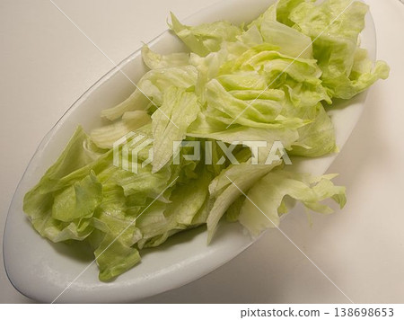 A simple lettuce salad, home-cooked meals prepared by my wife, dinner enjoyed at home, a happy family. A simple lettuce salad, home-cooked meals prepared by my wife, dinner enjoyed at home, a happy family. 138698653