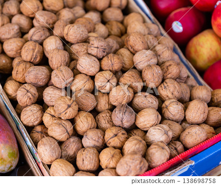 Many walnuts. Nuts in a box. Texture nuts Many walnuts. Nuts in a box. Texture nuts 138698758