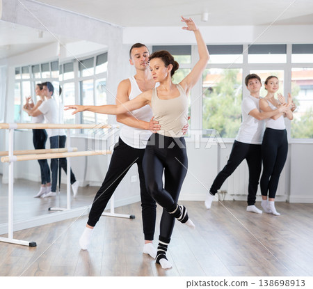 Young man and adult woman rehearsing pair ballet Young man and adult woman rehearsing pair ballet 138698913