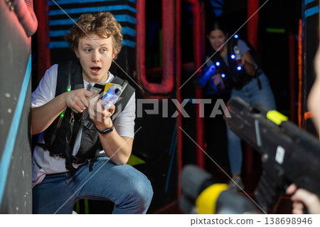 Young guy playing lasertag in arena 138698946
