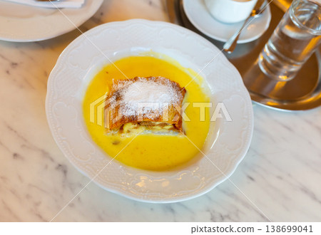 Popular confection is apple strudel with vanilla sauce Popular confection is apple strudel with vanilla sauce 138699041