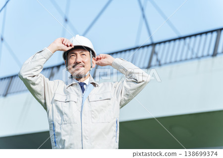 Senior, middle-aged, and older civil engineers Senior, middle-aged, and older civil engineers 138699374
