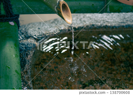 Water flowing from the bamboo at the shrine's purification fountain 138700608