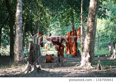 Forest tents, hanging robes and shaded paths create a clear retreat backdrop. The natural scene suits meditation and religion content. Forest tents, hanging robes and shaded paths create a clear retreat backdrop. The natural scene suits meditation and religion content. 138700661