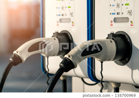 Electric car charging station for charge EV battery. Plug for vehicle with electric and hybrid engine. EV charger. Clean energy. Charging point for EV car. Green power. Future transport technology. 138700969
