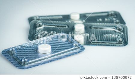 Emergency contraceptive pills in blister pack on blurred background of morning after pills. Drug cause of ectopic pregnancy. Emergency contraception for prevent pregnancy. World Contraception Day. 138700972