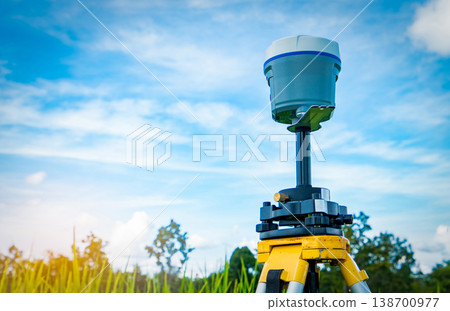 GPS surveying equipment on blue sky and white clouds background. GPS, GIS, and GNSS equipment. Land survey for map. Technology for marks land to made satellite map on the earth. Smart GNSS,GPS survey. GPS surveying equipment on blue sky and white clouds background. GPS, GIS, and GNSS equipment. Land survey for map. Technology for marks land to made satellite map on the earth. Smart GNSS,GPS survey. 138700977