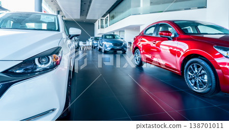 White car parked in luxury showroom. Car dealership office. New car parked in modern showroom. Car for sale and rent business concept. Automobile leasing and insurance concept. Electric vehicle. 138701011