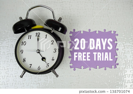 20 Days Free Trial text with alarm clock on purple background 20 Days Free Trial text with alarm clock on purple background 138701074