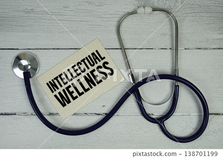 Intellectual Wellness text with Medical Stethoscope on wooden background 138701199