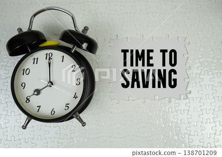Time To Saving text with alarm clock on white background Time To Saving text with alarm clock on white background 138701209