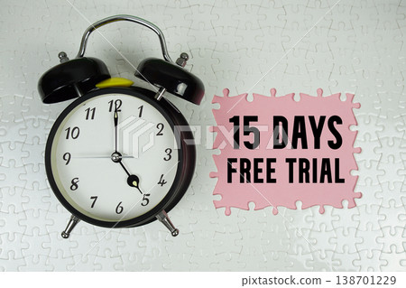 15 Days Free Trial text with alarm clock on pink background 15 Days Free Trial text with alarm clock on pink background 138701229