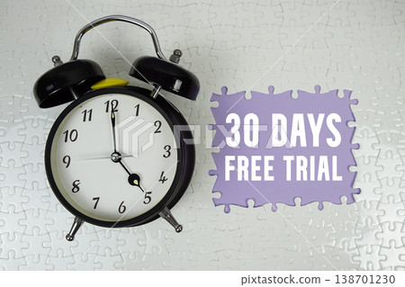 30 Days Free Trial text with alarm clock on purple background 30 Days Free Trial text with alarm clock on purple background 138701230