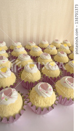 A row of fake sweets cupcakes A row of fake sweets cupcakes 138701373