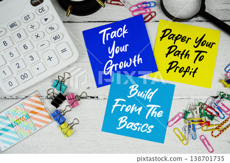 Track Your Growth, Paper Your Path To Profit, Build From The Basics text written on paper note with calculator and magnifying glass on wooden background Track Your Growth, Paper Your Path To Profit, Build From The Basics text written on paper note with calculator and magnifying glass on wooden background 138701735
