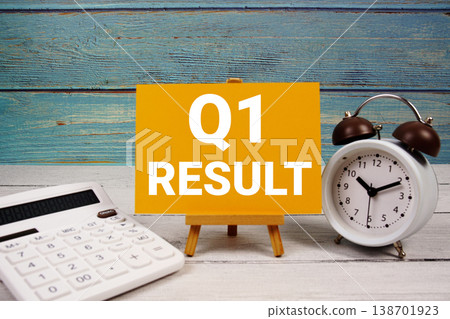 1st Quarter Financial Report text written on paper card with calculator and alarm clock on wooden background 1st Quarter Financial Report text written on paper card with calculator and alarm clock on wooden background 138701923