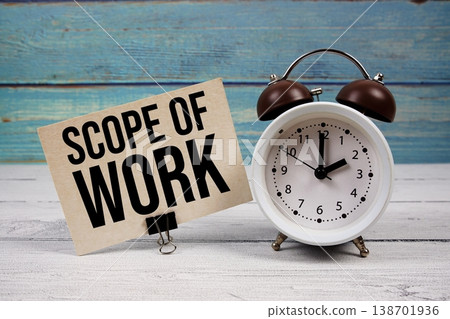 Scope Of Work text written on paper card with alarm clock on wooden background Scope Of Work text written on paper card with alarm clock on wooden background 138701936