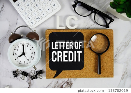LC Letter of Credit acronym with calculator, alarm clock and magnifying glass, business concept background 138702019