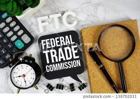 FTC - Federal Trade Commission acronym with calculator, alarm clock and magnifying glass, Business concept background FTC - Federal Trade Commission acronym with calculator, alarm clock and magnifying glass, Business concept background 138702031
