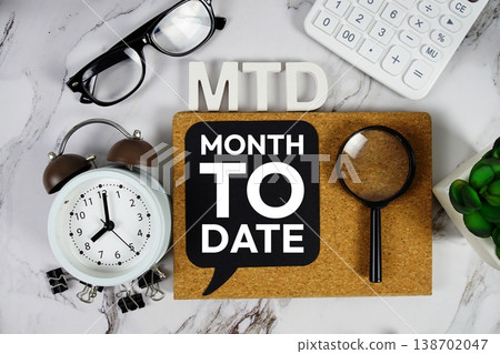 MTD - Month To Date acronym with calculator, alarm clock and magnifying glass, Business concept background MTD - Month To Date acronym with calculator, alarm clock and magnifying glass, Business concept background 138702047