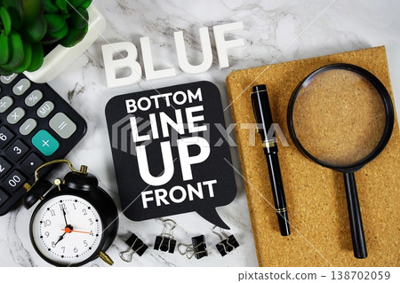 BLUF - Bottom Line Up Front acronym with calculator, alarm clock and magnifying glass, Business concept background 138702059