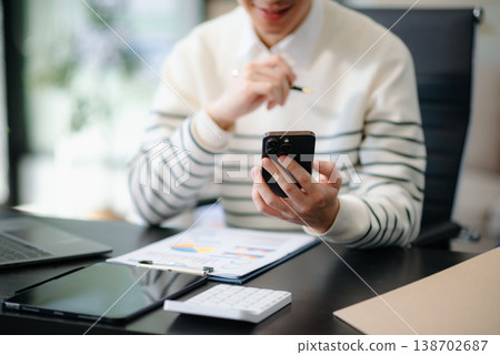 Businessmen analyzing investment graph and discussing plan new start up project. 138702687