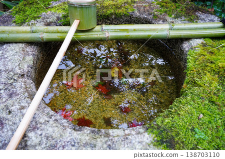 A water basin placed in the garden of a temple in Kyoto in autumn. A water basin placed in the garden of a temple in Kyoto in autumn. 138703110