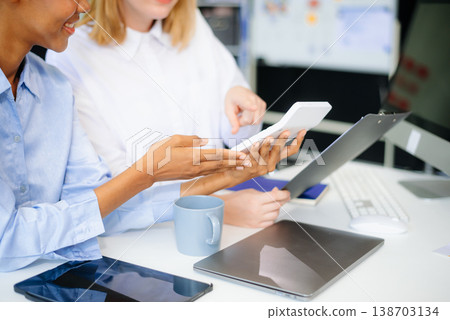 Team work process. Photo young business crew working with new startup project. Project managers meeting Team work process. Photo young business crew working with new startup project. Project managers meeting 138703134