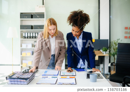 Female discussing new project with male colleague. Young woman talking 138703186