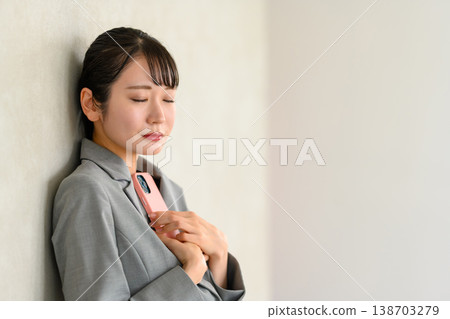 A woman hugging her smartphone A woman hugging her smartphone 138703279