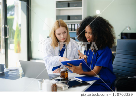 Medical, meeting and doctors with laptop for research, planning and hospital schedule management. Medical, meeting and doctors with laptop for research, planning and hospital schedule management. 138703329