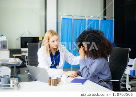 Professional healthcare scene featuring a doctor performing a patient checkup in a clinical setting Professional healthcare scene featuring a doctor performing a patient checkup in a clinical setting 138703506