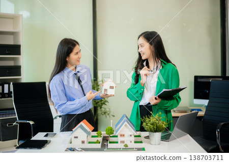 Signing a contract. Client and broker agent, lease agreement, successful deal and Young business sitting Signing a contract. Client and broker agent, lease agreement, successful deal and Young business sitting 138703711