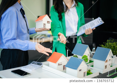 Signing a contract. Client and broker agent, lease agreement, successful deal and Young business sitting Signing a contract. Client and broker agent, lease agreement, successful deal and Young business sitting 138703712