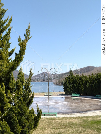 A park with cherry blossoms: Sanda Aono Dam, a water garden with cherry blossoms in full bloom. A park with cherry blossoms: Sanda Aono Dam, a water garden with cherry blossoms in full bloom. 138703753