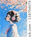 A girl listening to music under a cherry tree 138704079