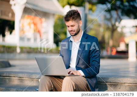 Businessman standing outdoors and using digital tablet. Perfect for corporate, technology, and professional themes Businessman standing outdoors and using digital tablet. Perfect for corporate, technology, and professional themes 138704179