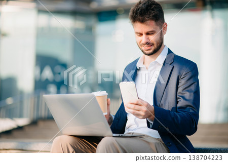 Businessman standing outdoors and using digital tablet. Perfect for corporate, technology, and professional themes Businessman standing outdoors and using digital tablet. Perfect for corporate, technology, and professional themes 138704223