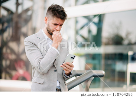 Businessman standing outdoors and using digital tablet. Perfect for corporate, technology, and professional themes 138704295