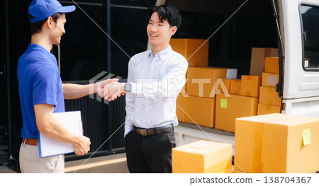 Asian Courier Delivering Package to man Delivery service near van outside the warehouse, delivery home Asian Courier Delivering Package to man Delivery service near van outside the warehouse, delivery home 138704367