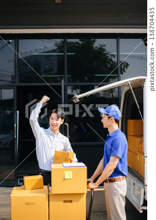 Delivery Asian man by sending box of parcel to customers service at home Delivery Asian man by sending box of parcel to customers service at home 138704435