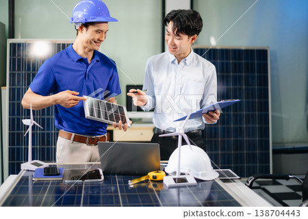 Engineer Team Meeting of Sustainable on a solar and wind energy project, discussing innovation Engineer Team Meeting of Sustainable on a solar and wind energy project, discussing innovation 138704443