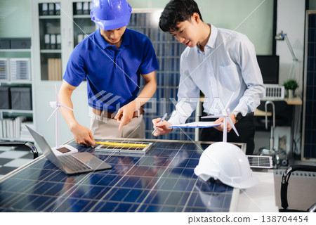 Engineer Team Meeting of Sustainable on a solar and wind energy project, discussing innovation 138704454