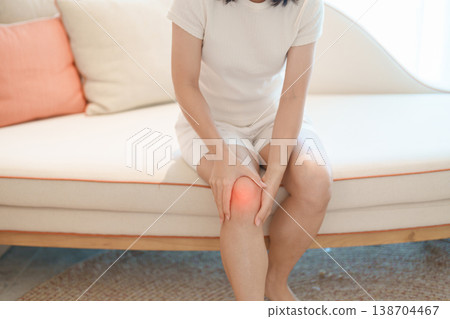 woman having knee ache and muscle pain due to Runners Knee or Patellofemoral Pain Syndrome, osteoarthritis, arthritis, rheumatism and Patellar Tendinitis. health and medical concept woman having knee ache and muscle pain due to Runners Knee or Patellofemoral Pain Syndrome, osteoarthritis, arthritis, rheumatism and Patellar Tendinitis. health and medical concept 138704467