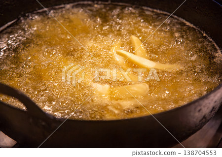 The oil used to fry french fries (simple cooking image) 138704553