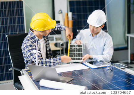 Business people having consultation about wind energy at company office. Business team discussing about windmill and alternative green energy. Business people having consultation about wind energy at company office. Business team discussing about windmill and alternative green energy. 138704697